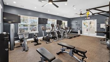 Fitness center with cardio equipment, fixed weight machines, free weights, exercise balls and stretching mats